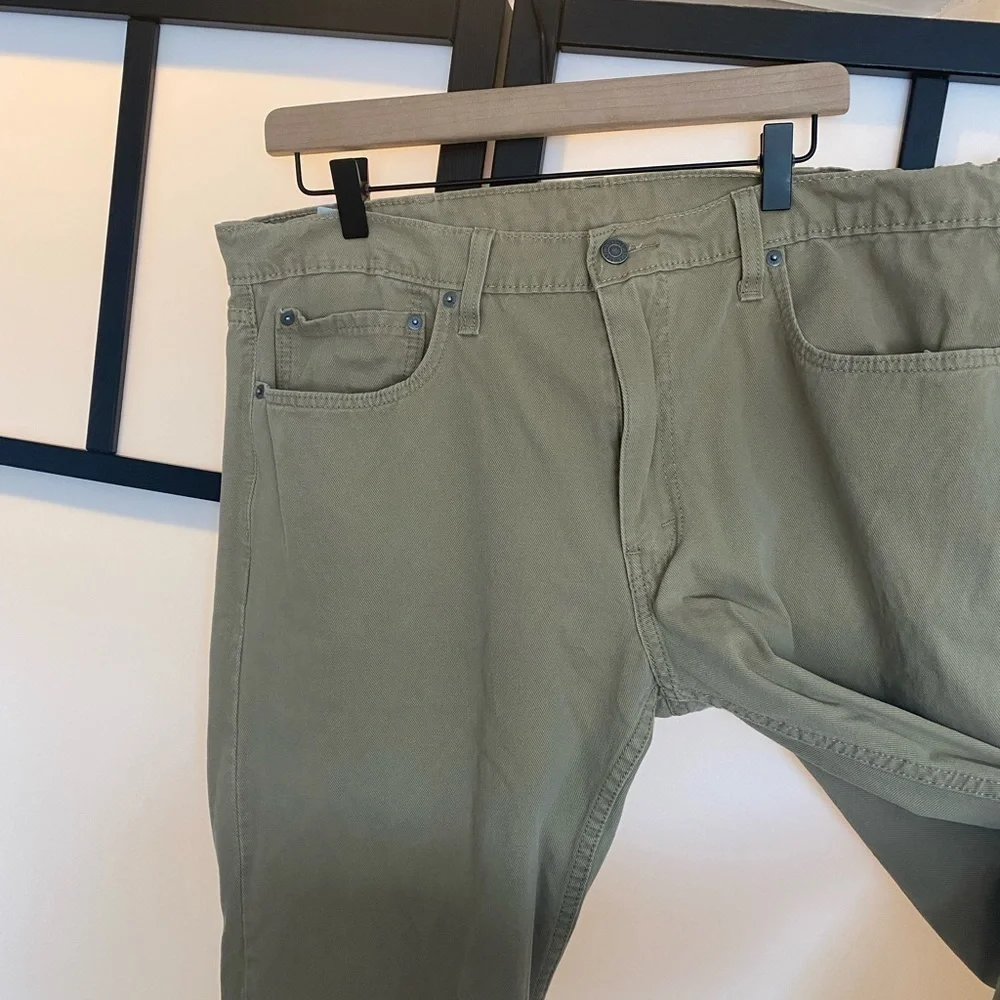 Levi's 502 tan pants. Size 36. HEMMED‎